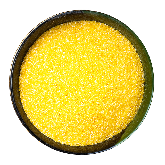 polenta cornmeal in round bowl isolated polenta cornmeal in round bowl isolated